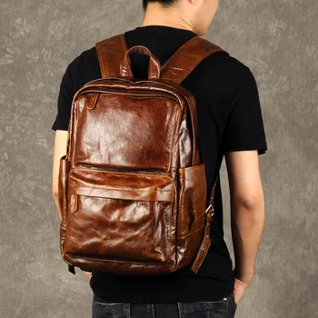 PNDME moda letnik visoke kakovosti pravega usnja za moške nahrbtnik priložnostne preprost cowhide oblikovalci luksuzna potovanja laptop bagpack